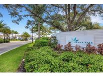 Sienna Park community entrance with lush landscaping and signage at 274 Via Anina Dr, Sarasota, FL 34243