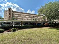 Condo building with ample parking and lush landscaping at 3620 Ironwood Cir # 206O, Bradenton, FL 34209