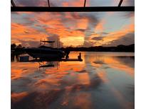 Stunning sunset view over the water from a private boat dock at 5403 Tidewater Preserve Blvd, Bradenton, FL 34208