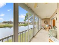 Spacious lanai overlooking a tranquil lake and golf course at 6620 Pineview Ter, Bradenton, FL 34203