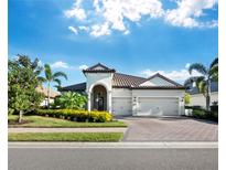 Beautiful single-story home with tile roof and two-car garage, landscaped front yard at 16528 Berwick Ter, Bradenton, FL 34202