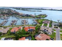Stunning aerial view of waterfront homes with a private marina and beautiful water views at 312 Yacht Harbor Dr, Osprey, FL 34229