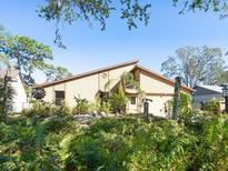 Unique home exterior with lush landscaping at 3888 Shady Brook Ln, Sarasota, FL 34243
