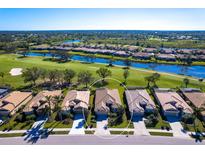 Aerial view of a home in a golf course community at 4451 Legacy Ct, Sarasota, FL 34241