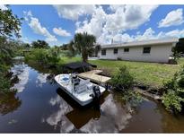 Private boat dock on a peaceful canal at 460 Creek Lane Dr, Englewood, FL 34223