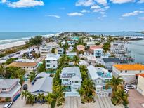 Beachfront property aerial view showcasing the home and neighborhood at 106 7Th S St, Bradenton Beach, FL 34217