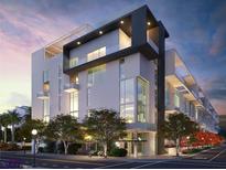 Modern condominium complex features sleek architecture, large windows, and a prime urban location at 1305 4Th St # 402P, Sarasota, FL 34236