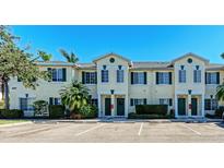 Front view of a three-unit townhouse building with parking at 227 Cape Harbour Loop # 103, Bradenton, FL 34212