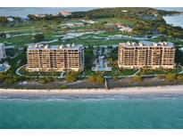 Luxury beachfront condo buildings with resort-style pool and golf course views at 415 L Ambiance Dr # A801, Longboat Key, FL 34228