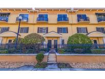 Three-story building with multiple units, featuring balconies and a gated entrance at 5252 W Kennedy Blvd # 5252, Tampa, FL 33609