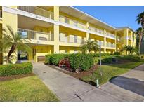 Building exterior showcasing the well-maintained landscaping and building facade at 2060 Willow Hammock Cir # 304, Punta Gorda, FL 33983