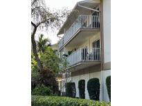 Building exterior showcasing balconies and landscaping at 1714 69Th W Ave # A207, Bradenton, FL 34207