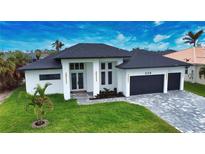 Modern two-story house with a dark roof and light-colored walls, a two-car garage and well-maintained lawn at 230 W Pine Valley Ln, Rotonda West, FL 33947