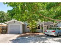 Cute bungalow style home with a carport and mature landscaping at 2574 Hawthorne St, Sarasota, FL 34239