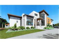 Modern two-story home with attached garage and landscaped yard at 5174 Sandy Cove Ave, Sarasota, FL 34242