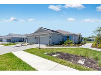 Beautiful single-story home with well-maintained landscaping, paver driveway and neutral-colored exterior at 8113 Moonbeam Ave, Sarasota, FL 34241