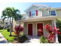 Two-story townhome with red doors and landscaping at 4850 51St W St # 8104, Bradenton, FL 34210