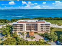 Luxury condo building with waterfront and golf course views at 3070 Grand Bay Blvd # 612, Longboat Key, FL 34228