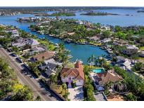 Bird's-eye view of waterfront home and community, highlighting the canal and surrounding area at 508 Siesta Dr, Sarasota, FL 34242