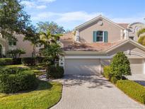 Two-story house with attached two-car garage and landscaped grounds at 5248 Bouchard Cir # 201, Sarasota, FL 34238