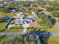 Aerial view of a single-Gathering home with a pool and fenced yard at 9716 28Th E St, Parrish, FL 34219