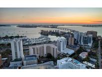 Aerial view of waterfront community with sunset at 1255 N Gulfstream Ave # 1105, Sarasota, FL 34236