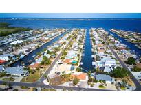 Aerial view of waterfront home with private dock and boat access at 9820 Royal Palm Dr, Bradenton, FL 34210