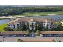 Luxury condo building with lake and golf course views at 17118 Vardon Ter # 305, Bradenton, FL 34211