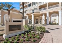 Elegant building exterior with landscaped grounds and welcoming entrance at 35 Watergate Dr # 801, Sarasota, FL 34236