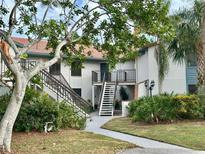 Two-story building with walkway, stairs, and landscaping at 4445 46Th W Ave, Bradenton, FL 34210