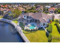 Luxury waterfront home with pool and dock, offering stunning canal views at 504 Mast Dr, Bradenton, FL 34208