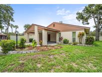 Charming single-story home with a stucco exterior, carport, and attractive landscaping at 5111 26Th St. Ct, W # 53, Bradenton, FL 34207