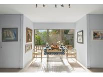 Bright breakfast nook features charming decor and natural light from the large window at 3350 Old Oak Dr, Sarasota, FL 34239