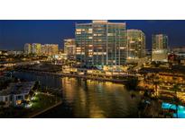 Luxury waterfront condo building with city views at night at 401 Quay Commons # 901, Sarasota, FL 34236