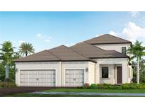 Two-story home with a three-car garage and attractive landscaping at 425 Alberata Way, Nokomis, FL 34275