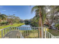 Relaxing balcony view overlooking a pond and lush landscaping at 850 S Tamiami Trl # 731, Sarasota, FL 34236
