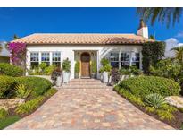 Charming Spanish style home with a beautiful landscape and brick paver driveway at 1923 Hibiscus St, Sarasota, FL 34239