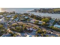 Aerial view of a home located in a neighborhood by the water at 451 Bowdoin Cir, Sarasota, FL 34236
