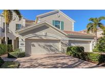 Attractive two-story home with a two-car garage and lush landscaping at 7502 Botanica Pkwy # 7502, Sarasota, FL 34238