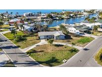 Charming single-story home with a well-maintained yard and waterfront views in a desirable neighborhood at 806 Arlington Rd, Palmetto, FL 34221