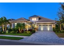 Stunning two-story home with a charming facade and landscaped yard at 15407 Castle Park Ter, Lakewood Ranch, FL 34202