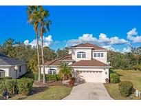 Beautiful two-story home with a two-car garage and lush landscaping at 12342 Lavender Loop, Bradenton, FL 34212