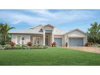 Charming coastal home with a welcoming front porch and lush landscaping at 17942 Palmiste Dr, Bradenton, FL 34202