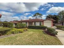 Single-story home with attached garage and well-manicured landscaping at 3001 Vivienda Blvd, Bradenton, FL 34207