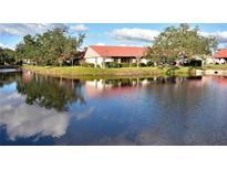 Community view showcasing water features and homes at 6564 Draw Ln # 102, Sarasota, FL 34238