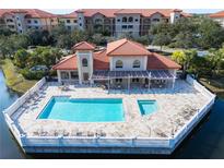 Resort-style pool and spa with clubhouse and deck at 7702 Lake Vista Ct # 306, Lakewood Ranch, FL 34202