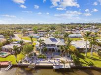 Large house by the water with a dock and boats at 2127 Lusitania Dr, Sarasota, FL 34231