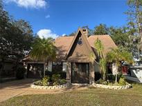A-frame home with stone accents and landscaping at 3455 Gardenia St, Sarasota, FL 34237