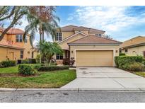 Beautiful two-story house with a two-car garage and lush landscaping at 7416 Birds Eye Ter, Bradenton, FL 34203