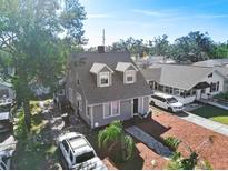 Aerial view of a charming house with a gray exterior and landscaped yard at 766 13Th S Ave, St Petersburg, FL 33701